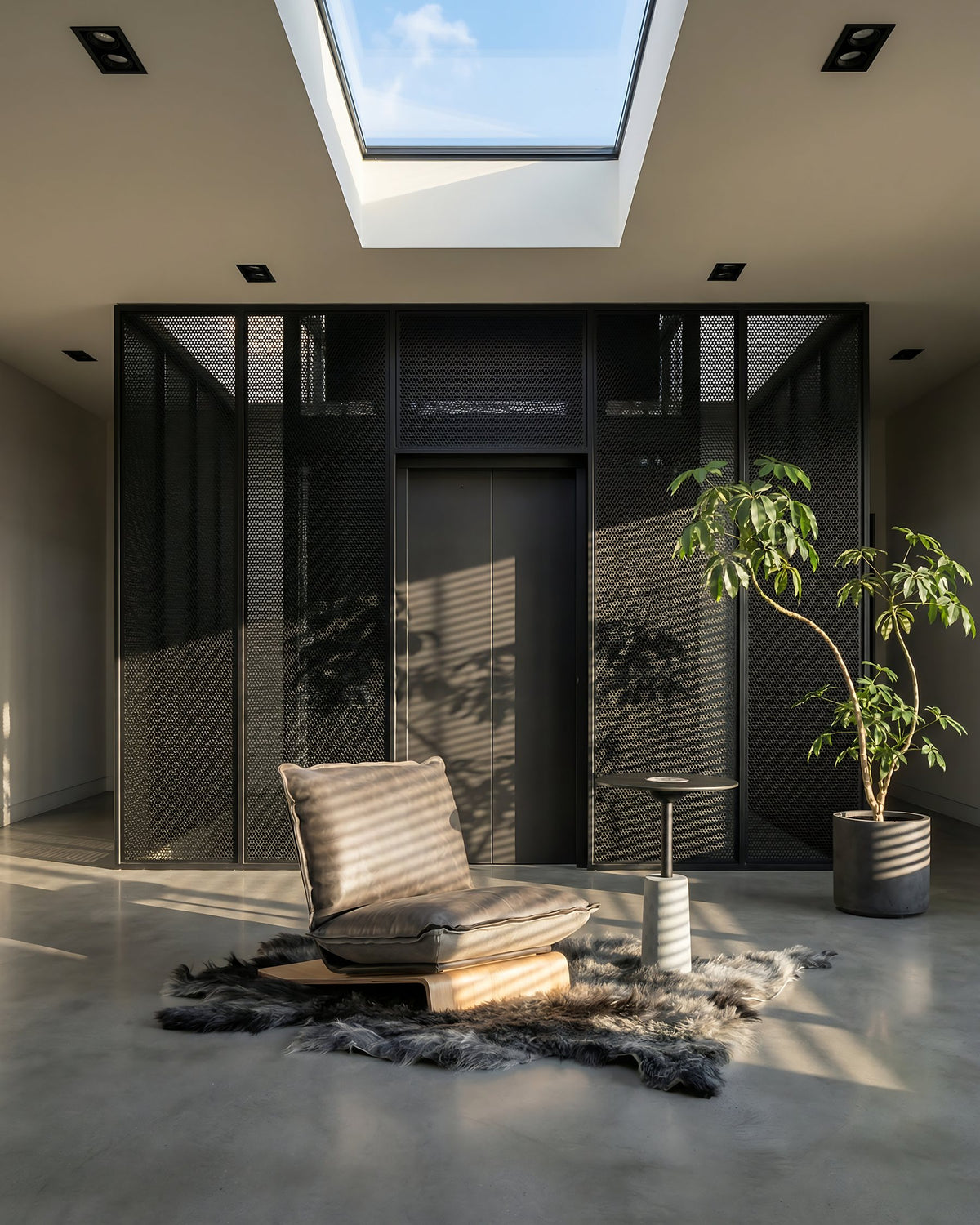 Skin sofa in yak leather with sheepskin rug in a sunlit interior