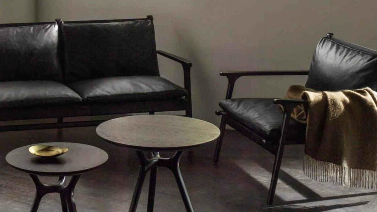 CHIC Moo lounge chairs and sofa in black leather with side tables