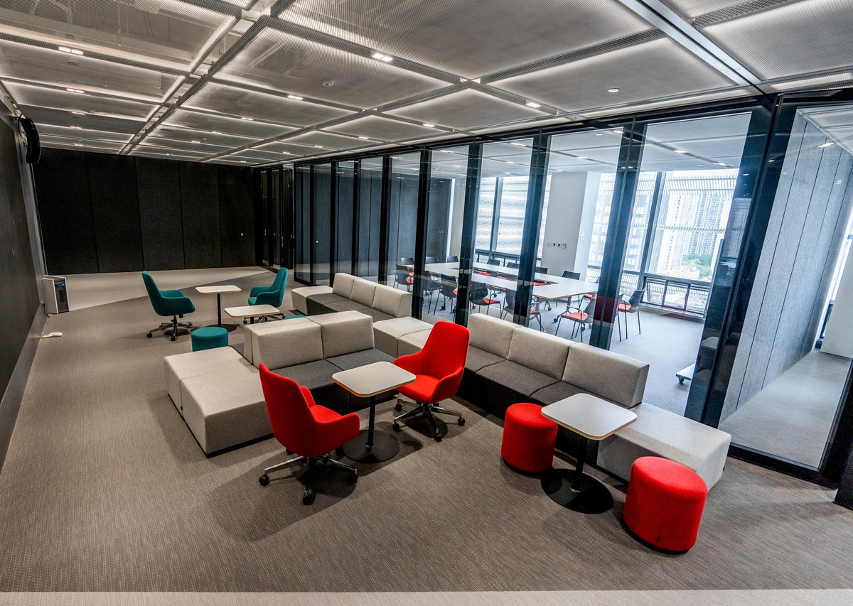 Red Tulip swivel chairs in an open office lounge