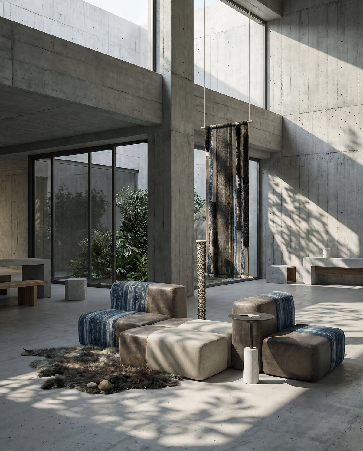 NOMAD Cubes Set with yak fabric and leather in a concrete atrium