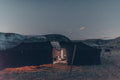 NOMAD Tent in Nakura black set up outdoors at dusk