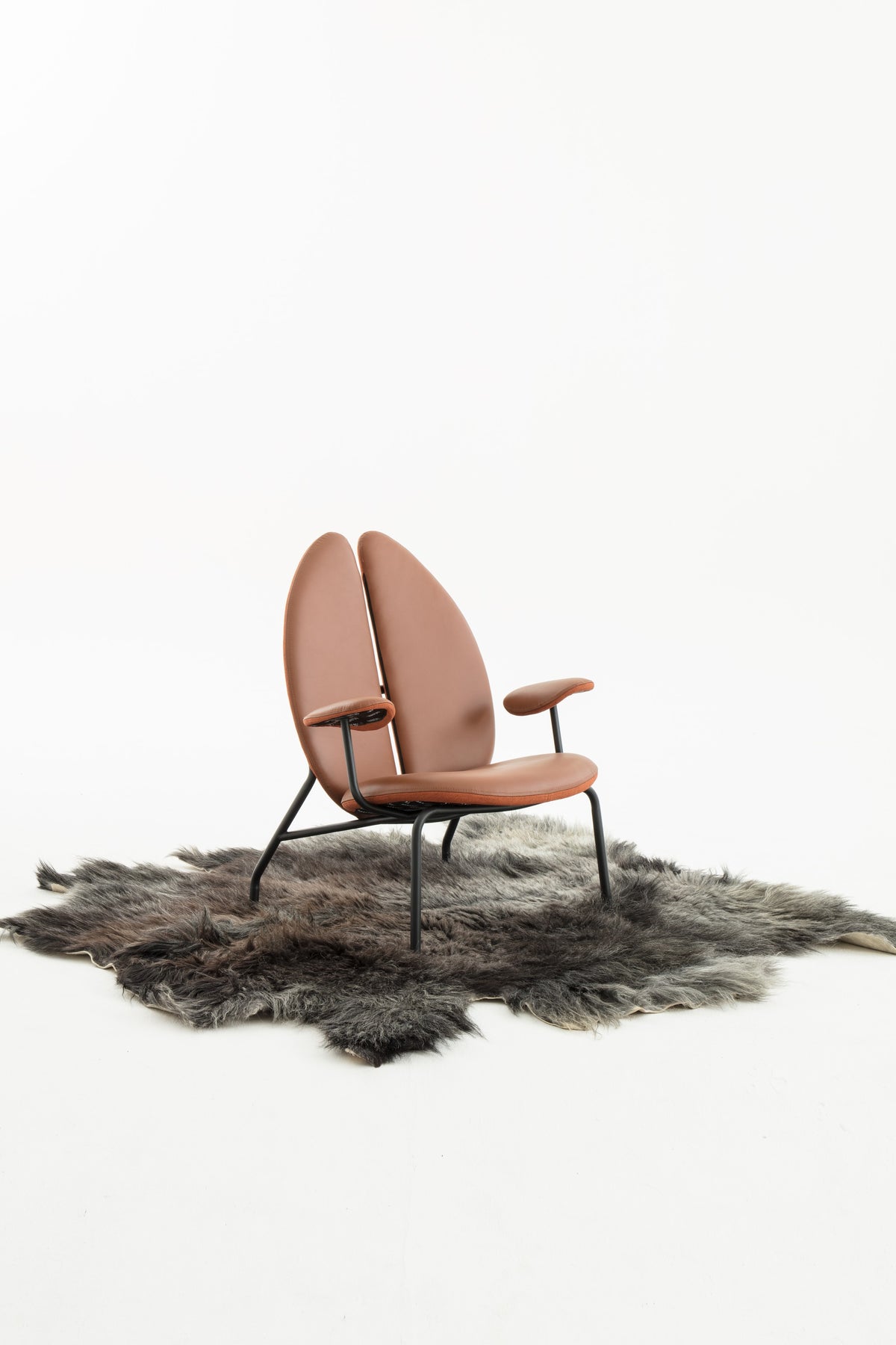 NOMAD Coffee Chair with yak skin rug – studio shot